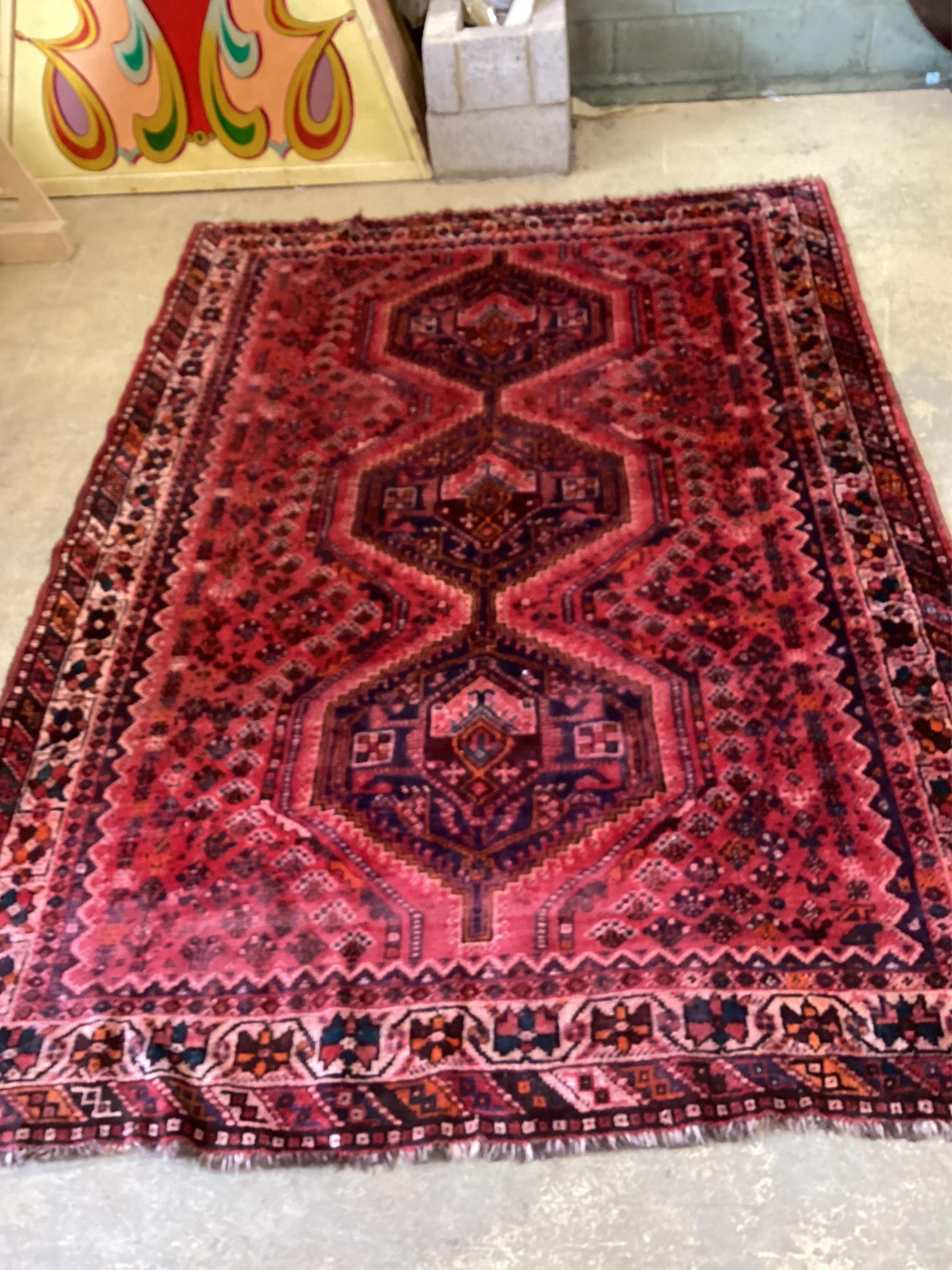 A North West Persian red ground carpet, 294 x 205cm. Condition - fair